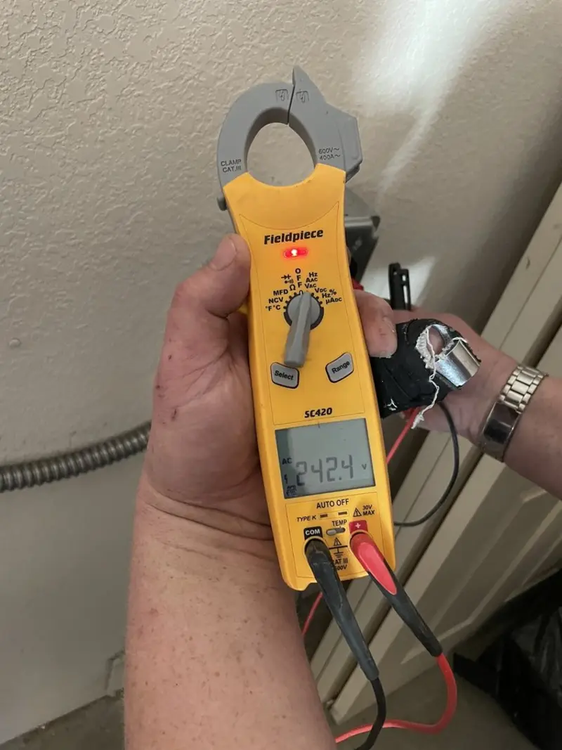 Voltage testing with clamp meter during Ceiling Fan Installation in Ottawa
